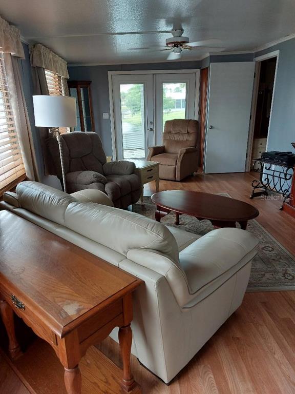 12531 Southeast 140th Avenue, Unit 118 Okeechobee, FL 34974 - Photo 7 of 26 a living room with furniture and a window