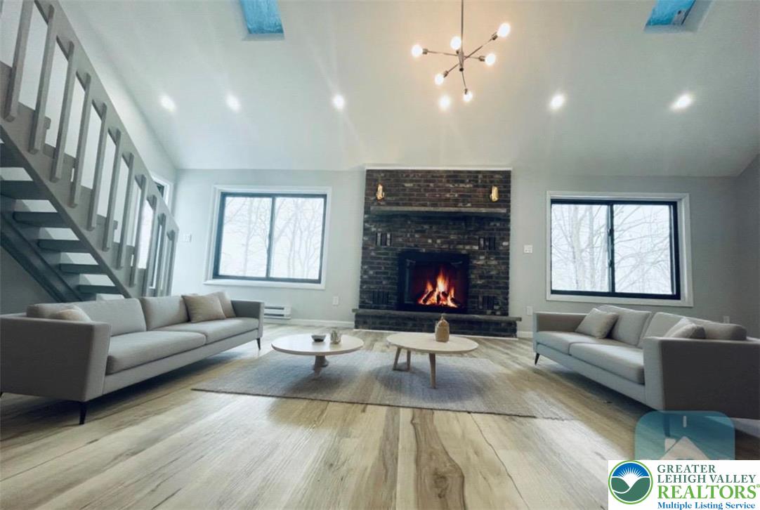103 Ashley Court Bushkill, PA 18324 - Photo 18 of 68 Cozy wood-burning fireplace in a virtually staged, unfurnished home.
