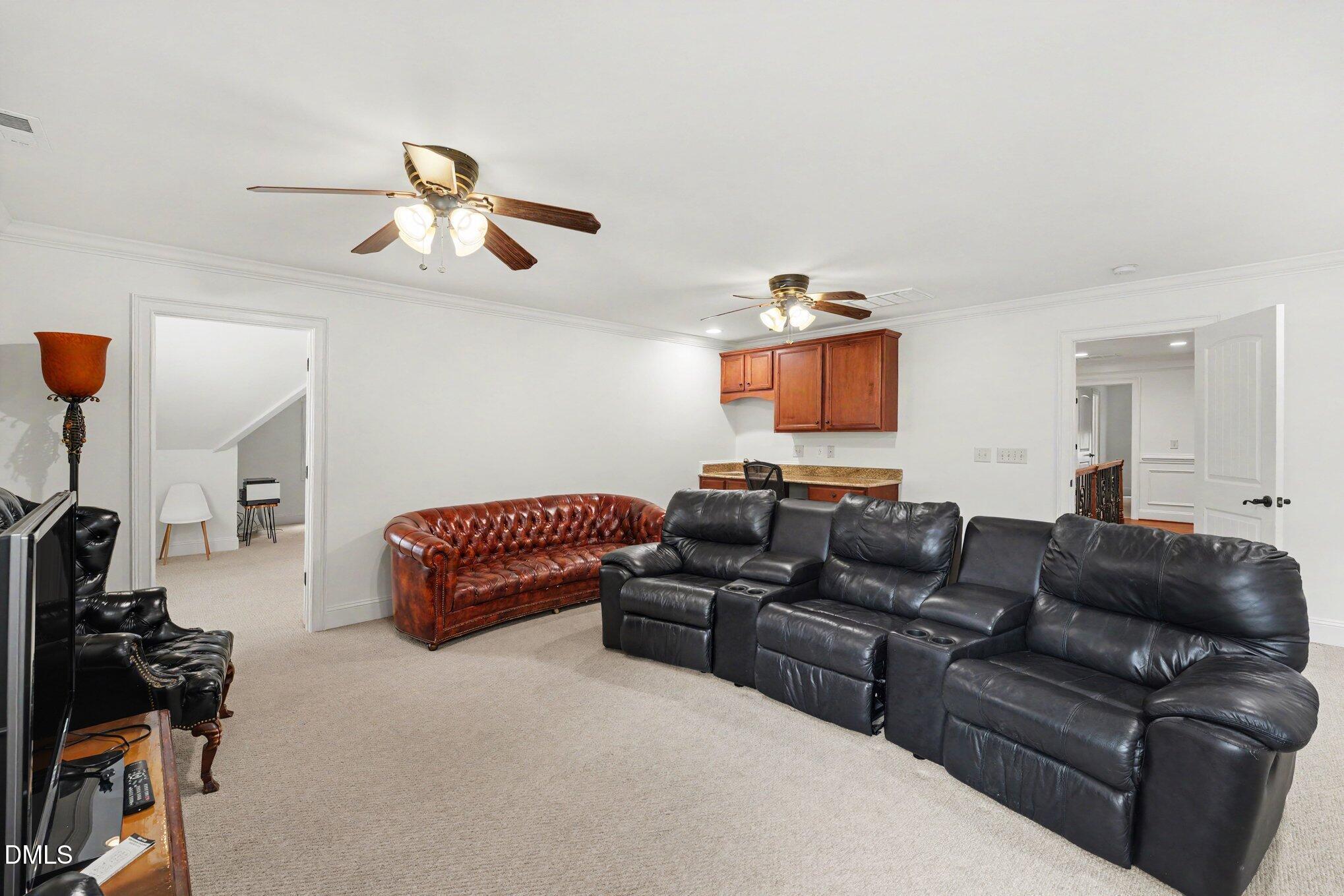 1729 Frenchwood Drive Raleigh, NC 27612 - Photo 25 of 46 a living room with furniture and a flat screen tv