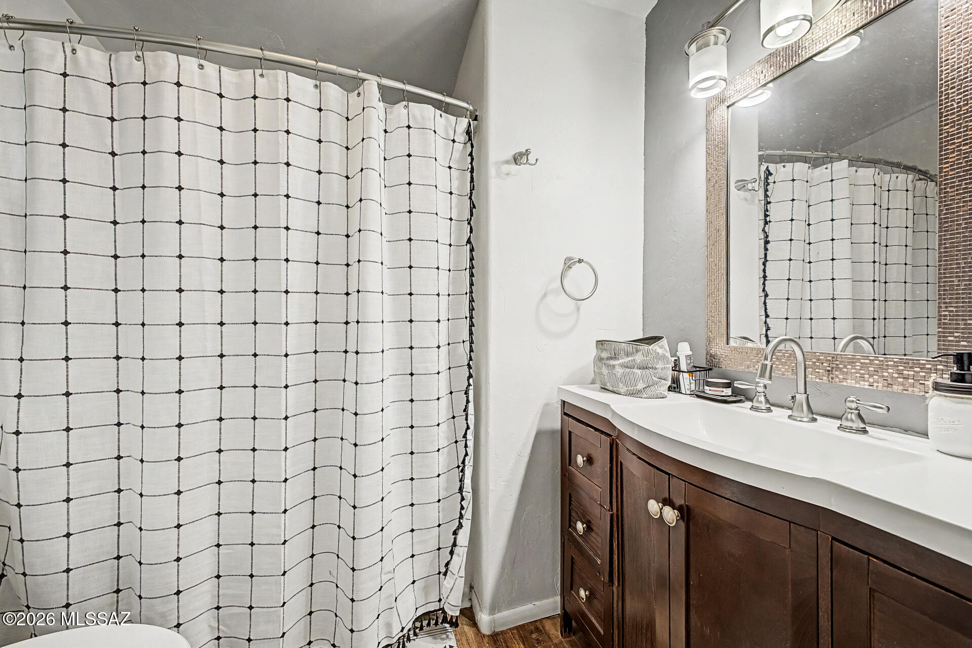 4231 East Pinal Street Tucson, AZ 85739 - Photo 26 of 36 a bathroom with a sink mirror and shower