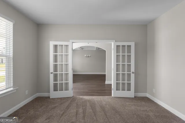 an empty room with windows