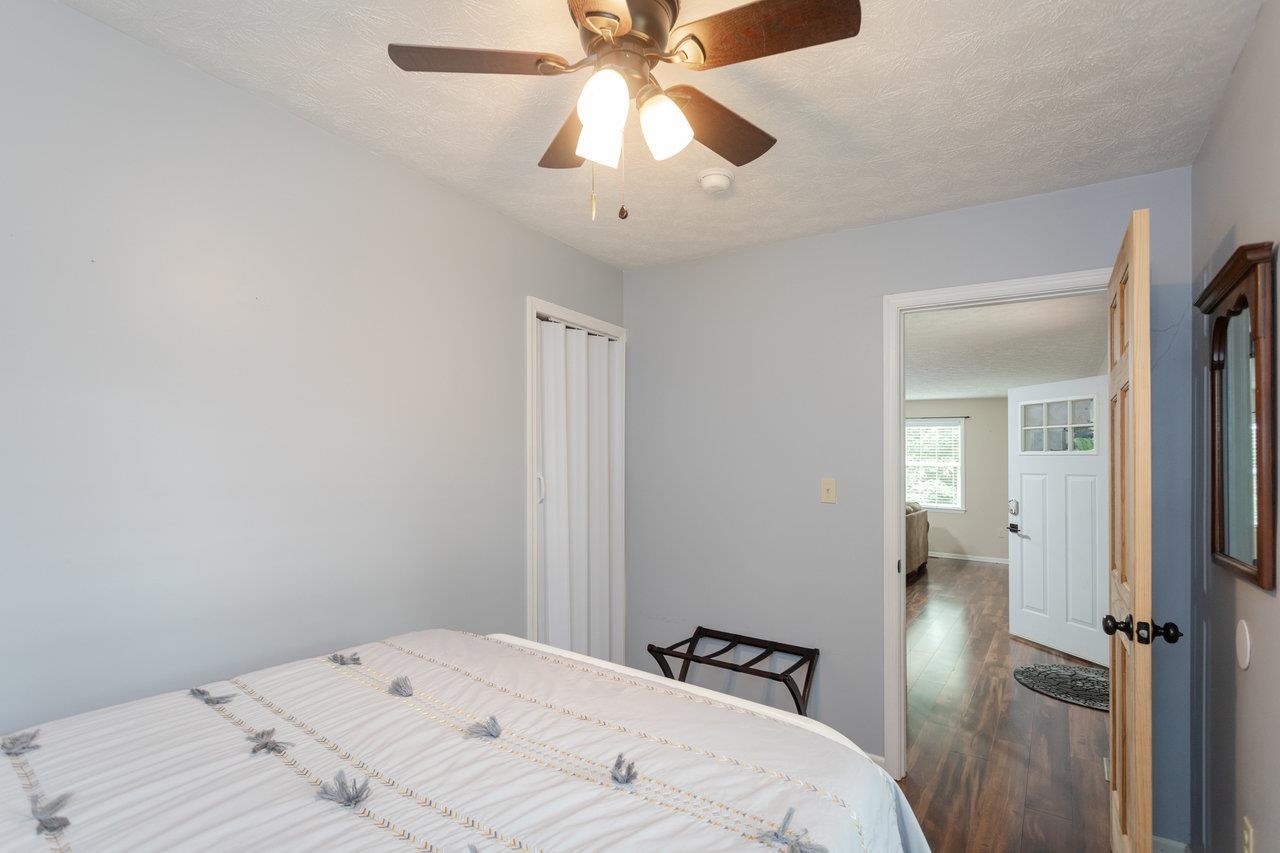 159 Park View Shenandoah, VA 22849 - Photo 24 of 70 a bedroom with a bed and a chandelier