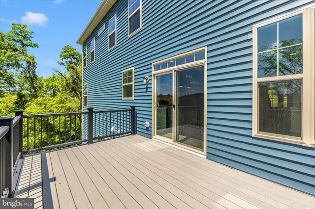 a bedroom with a bed couch and window