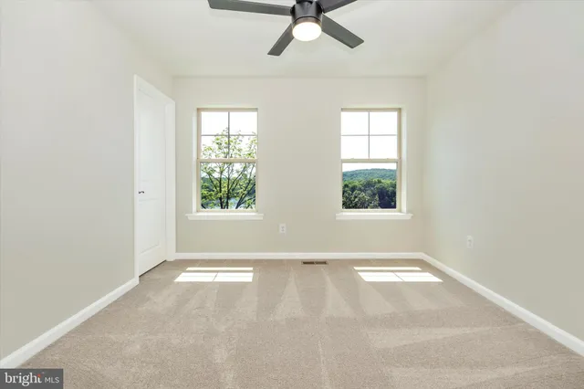 a view of a lake with a yard