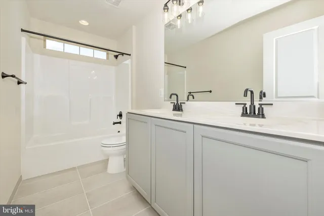 a view of a lake with a table and chairs