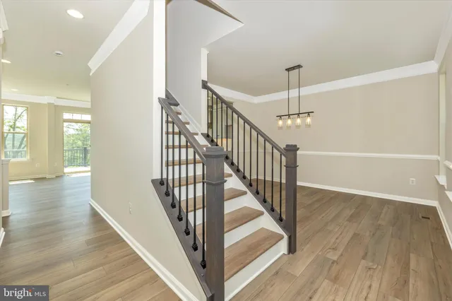 a view of an entryway with wooden floor