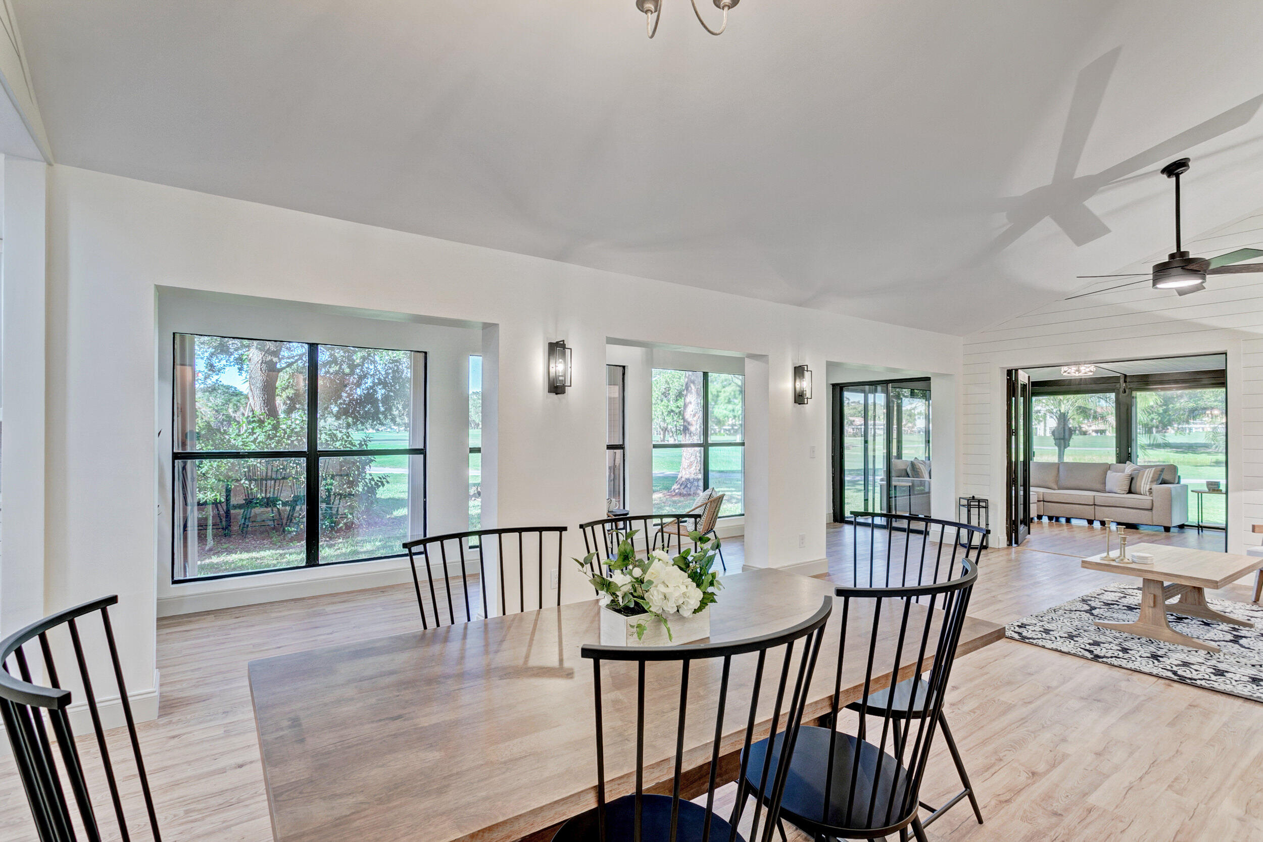 24 Ironwood Way North Palm Beach Gardens, FL 33418 - Photo 12 of 74 a view of a dining room with furniture window and outside view
