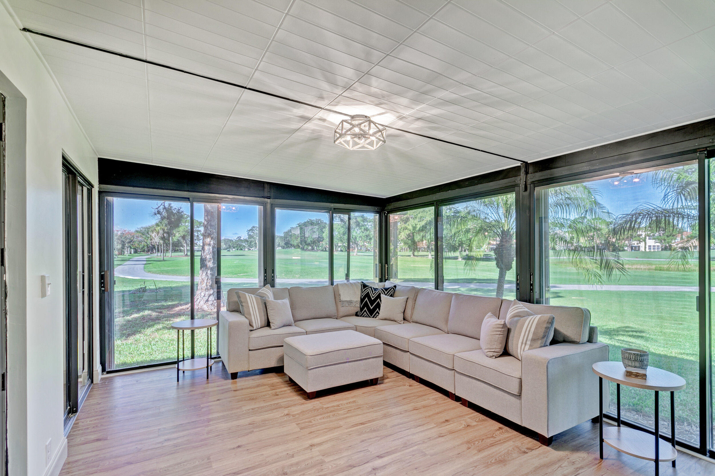 24 Ironwood Way North Palm Beach Gardens, FL 33418 - Photo 22 of 74 a living room with furniture and a large window