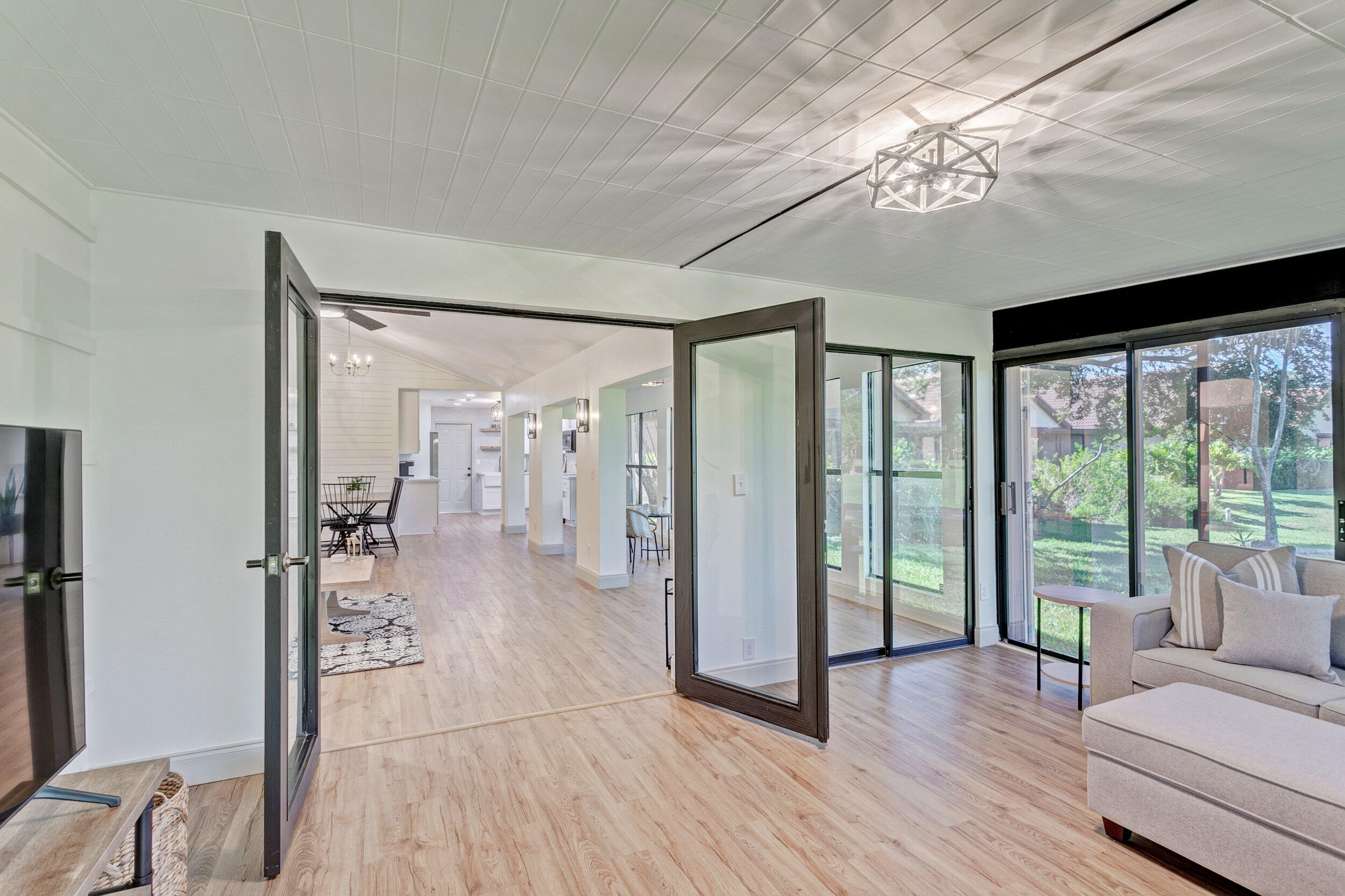 24 Ironwood Way North Palm Beach Gardens, FL 33418 - Photo 24 of 74 a living room with furniture and a chandelier
