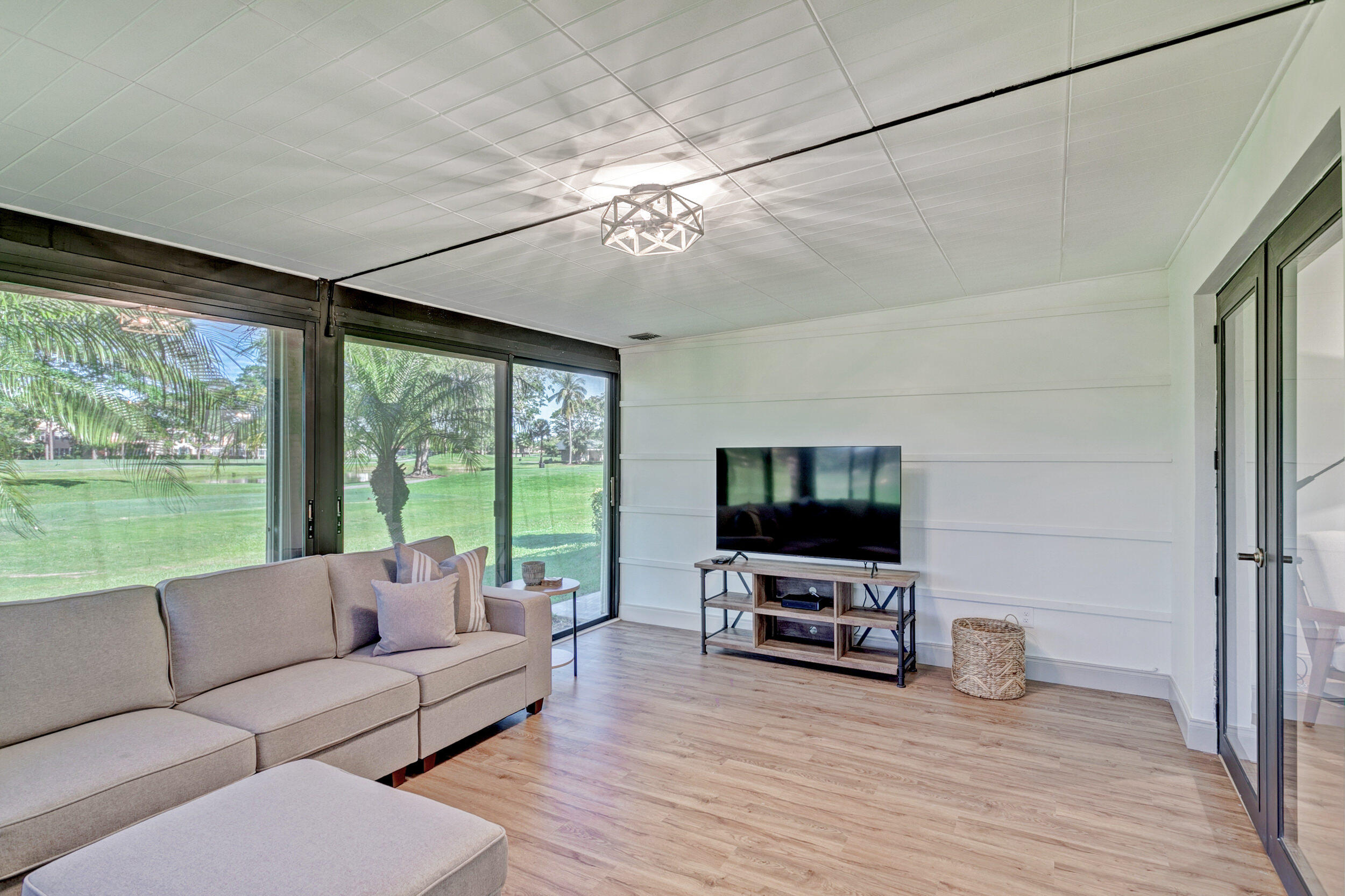 24 Ironwood Way North Palm Beach Gardens, FL 33418 - Photo 26 of 74 a living room with furniture and a flat screen tv