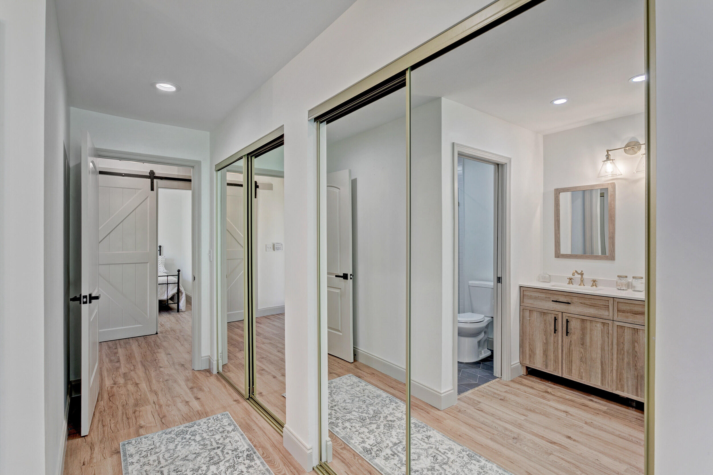 24 Ironwood Way North Palm Beach Gardens, FL 33418 - Photo 30 of 74 a bathroom with a double vanity sink a mirror and a shower