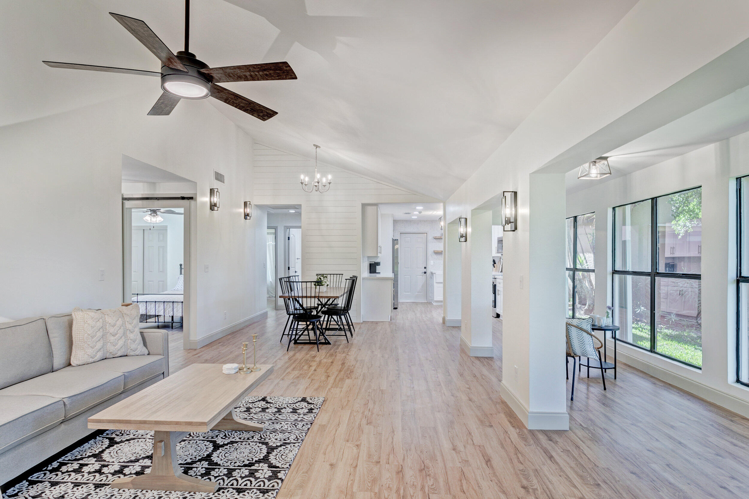 24 Ironwood Way North Palm Beach Gardens, FL 33418 - Photo 3 of 74 a living room with furniture and a wooden floor
