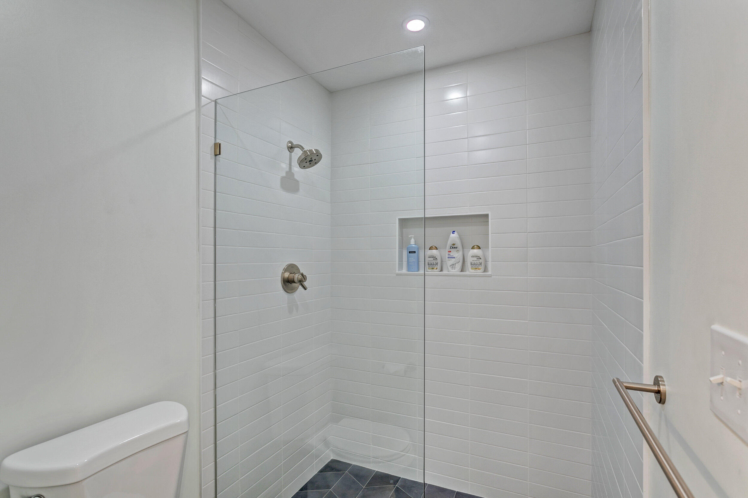 24 Ironwood Way North Palm Beach Gardens, FL 33418 - Photo 33 of 74 a bathroom with a shower a toilet and sink