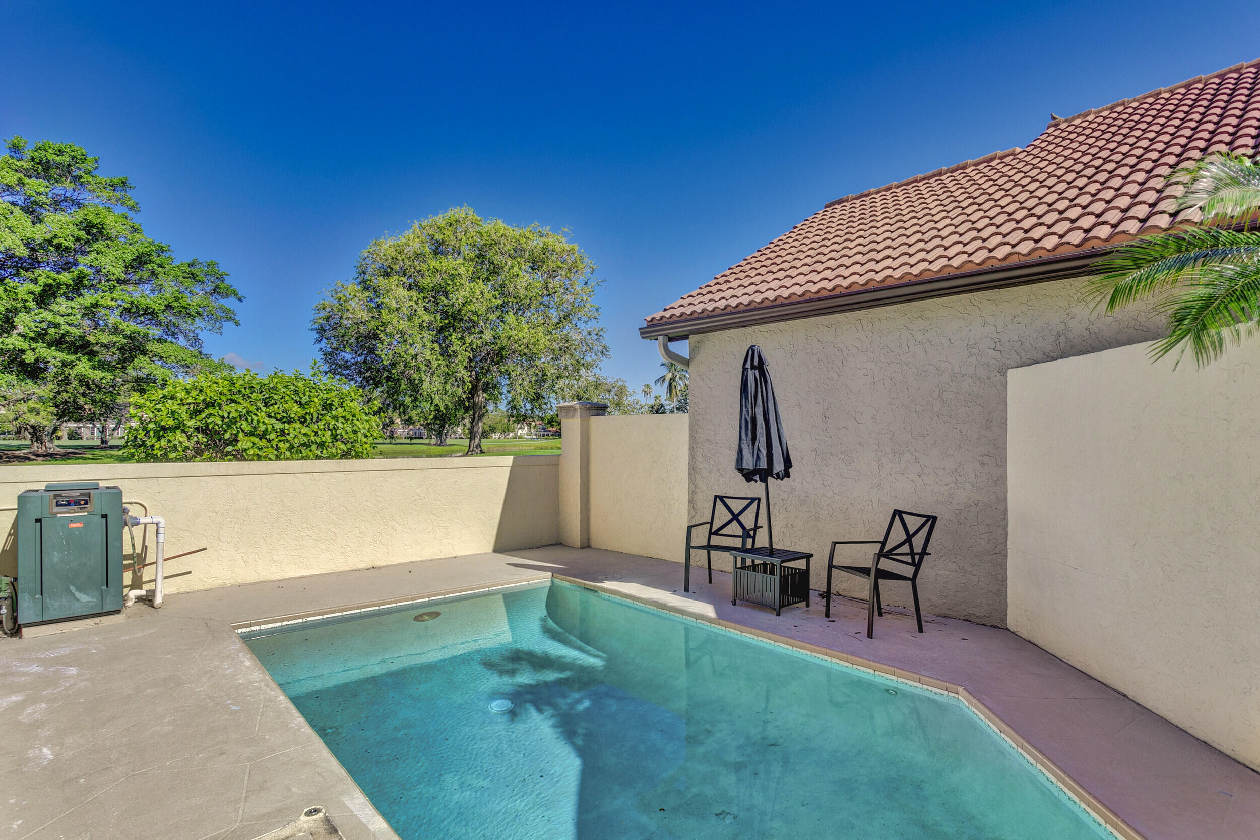24 Ironwood Way North Palm Beach Gardens, FL 33418 - Photo 43 of 74 a view of a backyard with sitting area