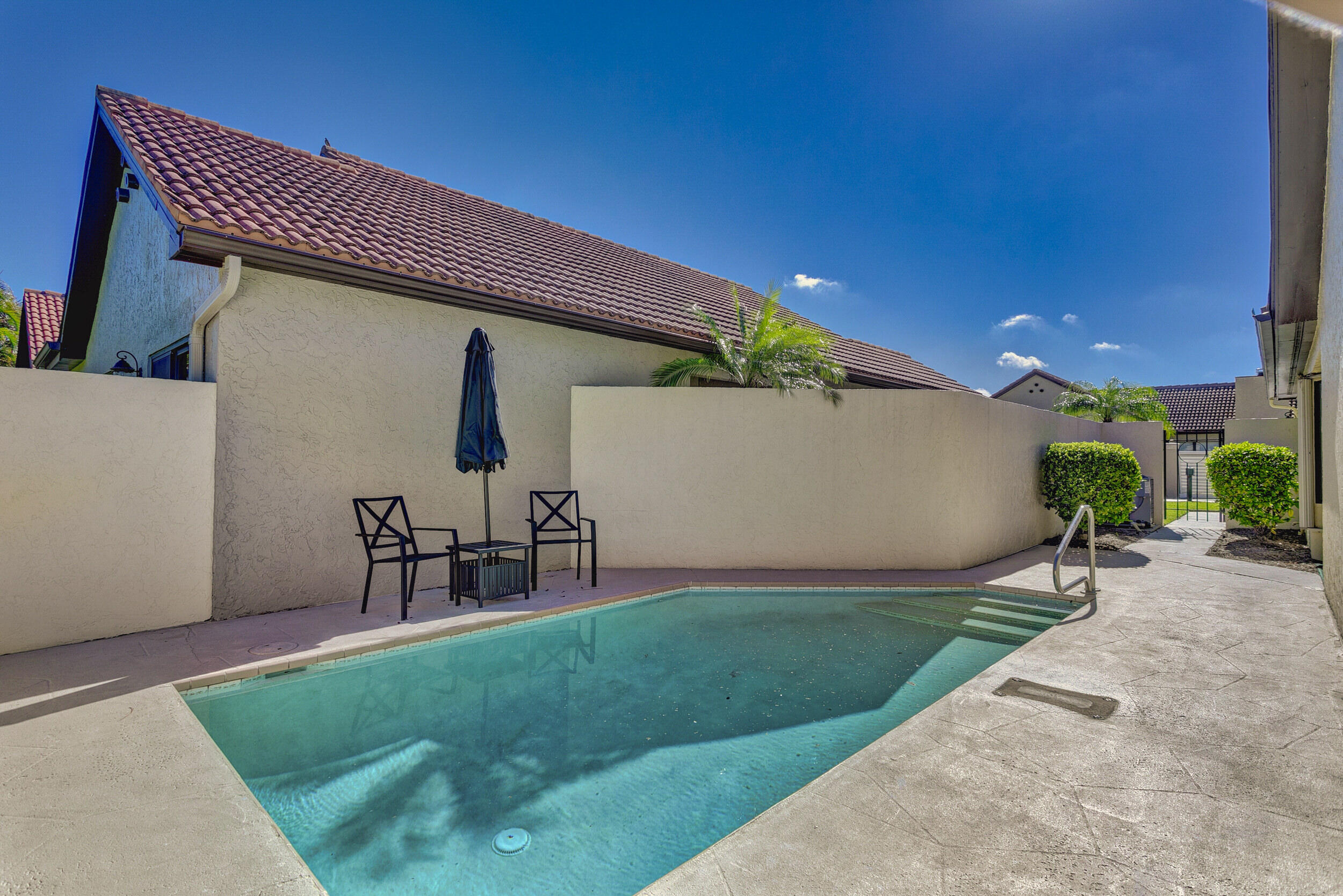 24 Ironwood Way North Palm Beach Gardens, FL 33418 - Photo 46 of 74 a front view of a house with garden