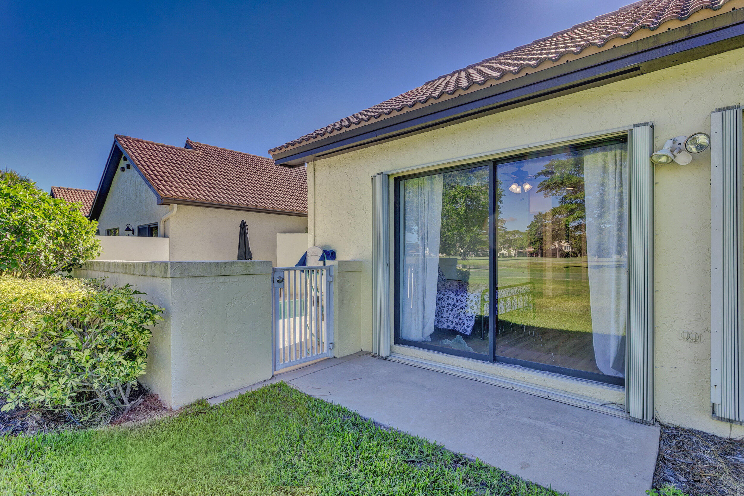 24 Ironwood Way North Palm Beach Gardens, FL 33418 - Photo 47 of 74 a house view with a garden space