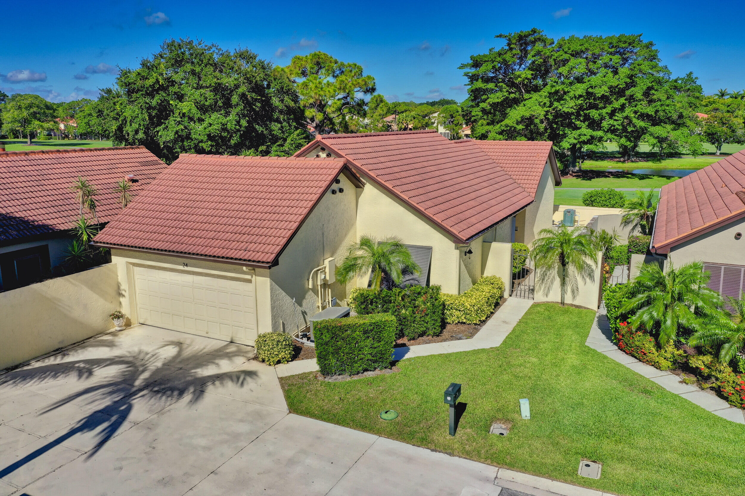 24 Ironwood Way North Palm Beach Gardens, FL 33418 - Photo 48 of 74 a view of a house with a yard