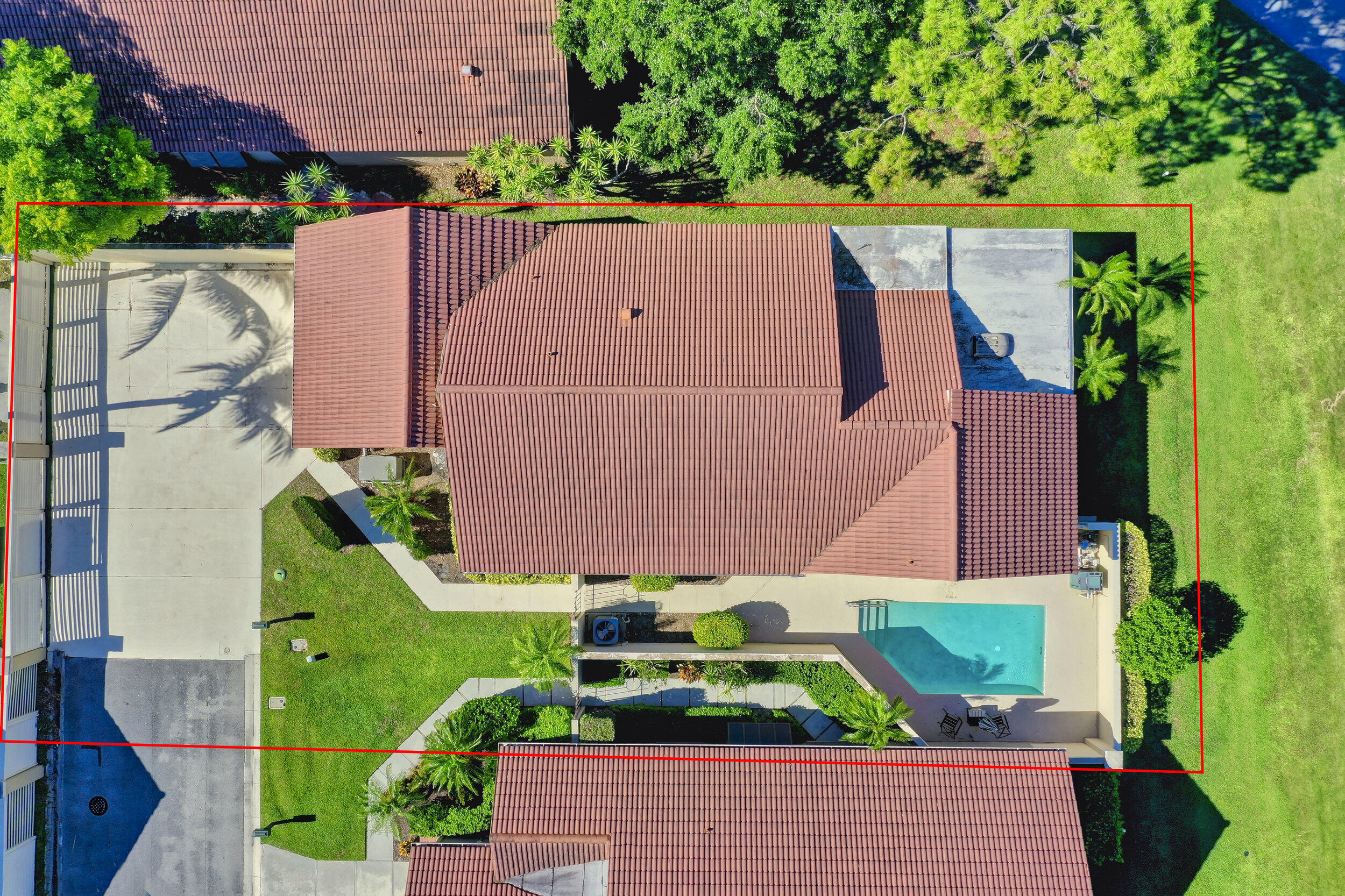 24 Ironwood Way North Palm Beach Gardens, FL 33418 - Photo 58 of 74 an aerial view of multiple houses with a yard