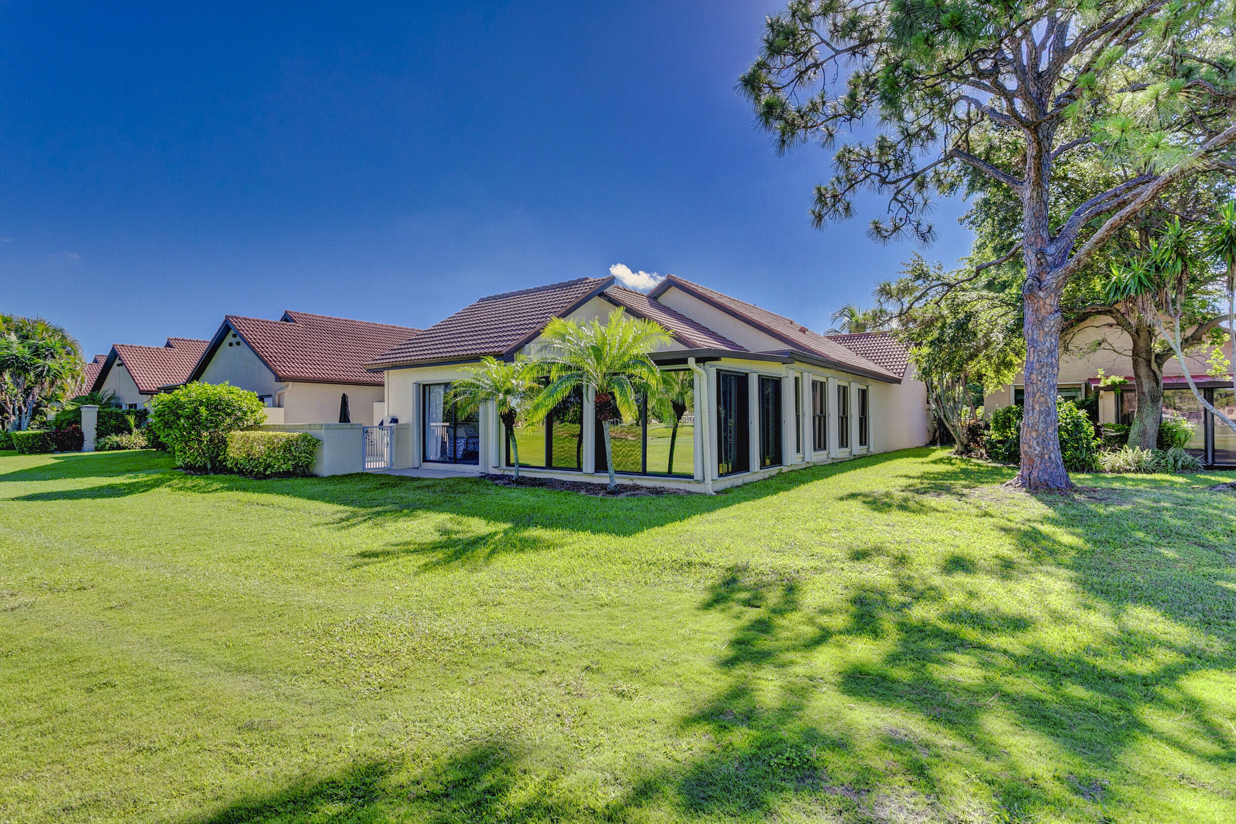 24 Ironwood Way North Palm Beach Gardens, FL 33418 - Photo 63 of 74 a front view of a house with yard and green space