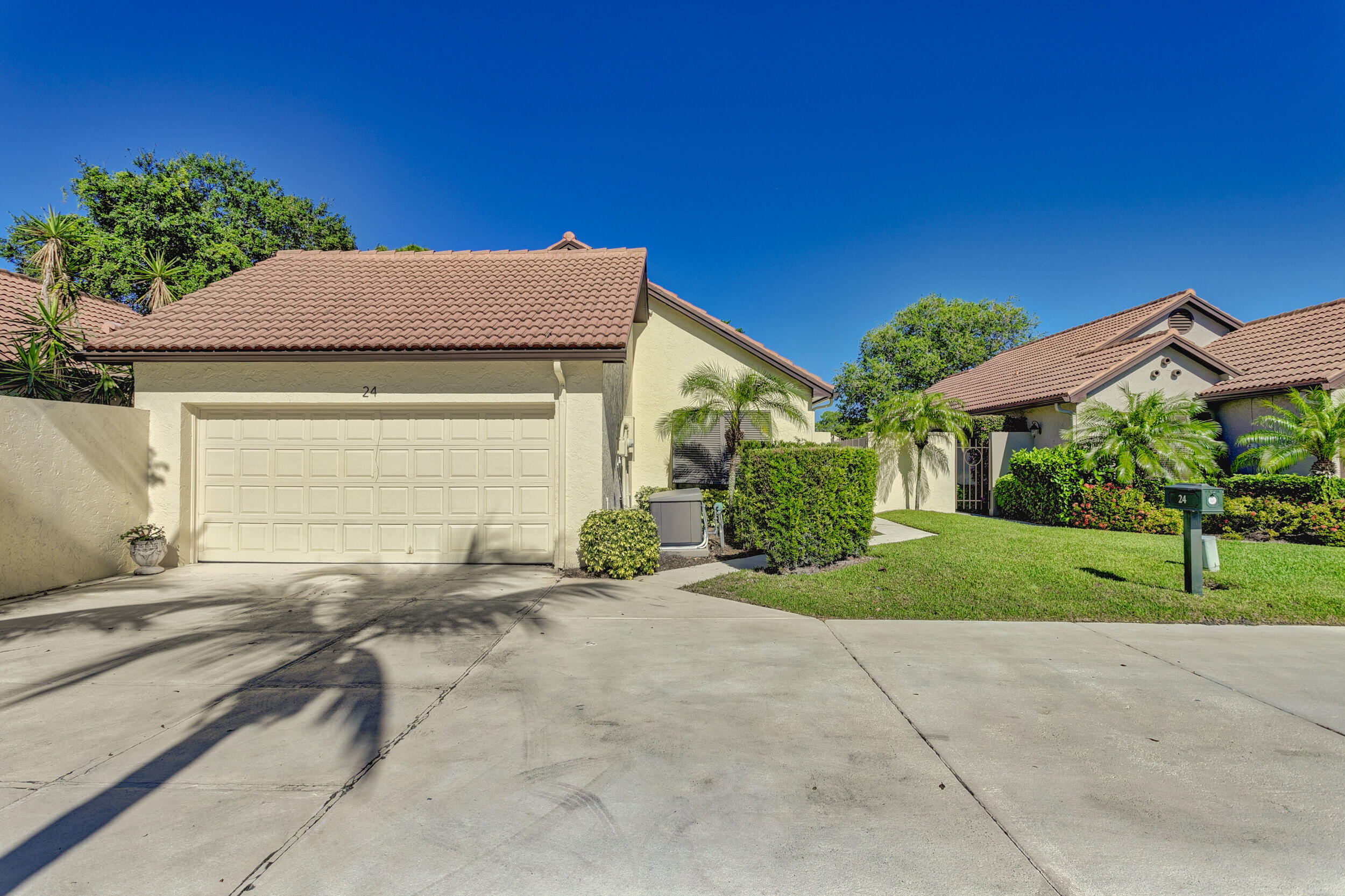 24 Ironwood Way North Palm Beach Gardens, FL 33418 - Photo 65 of 74 a view of backyard of house and green space