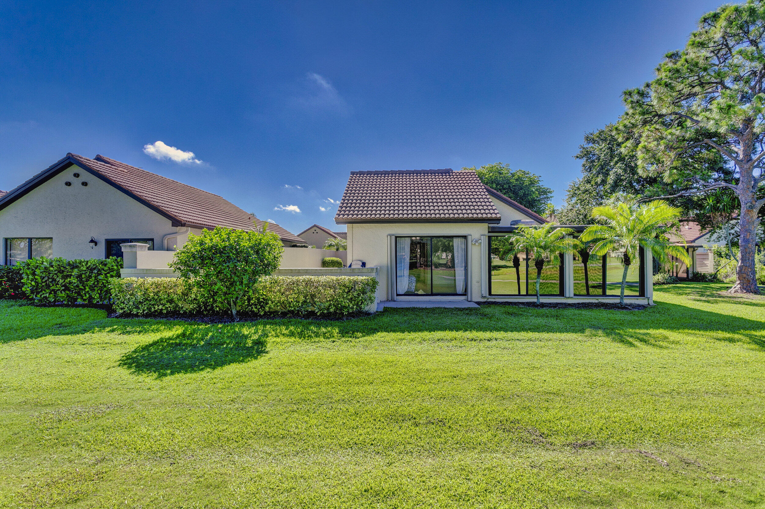 24 Ironwood Way North Palm Beach Gardens, FL 33418 - Photo 66 of 74 a front view of a house with a yard