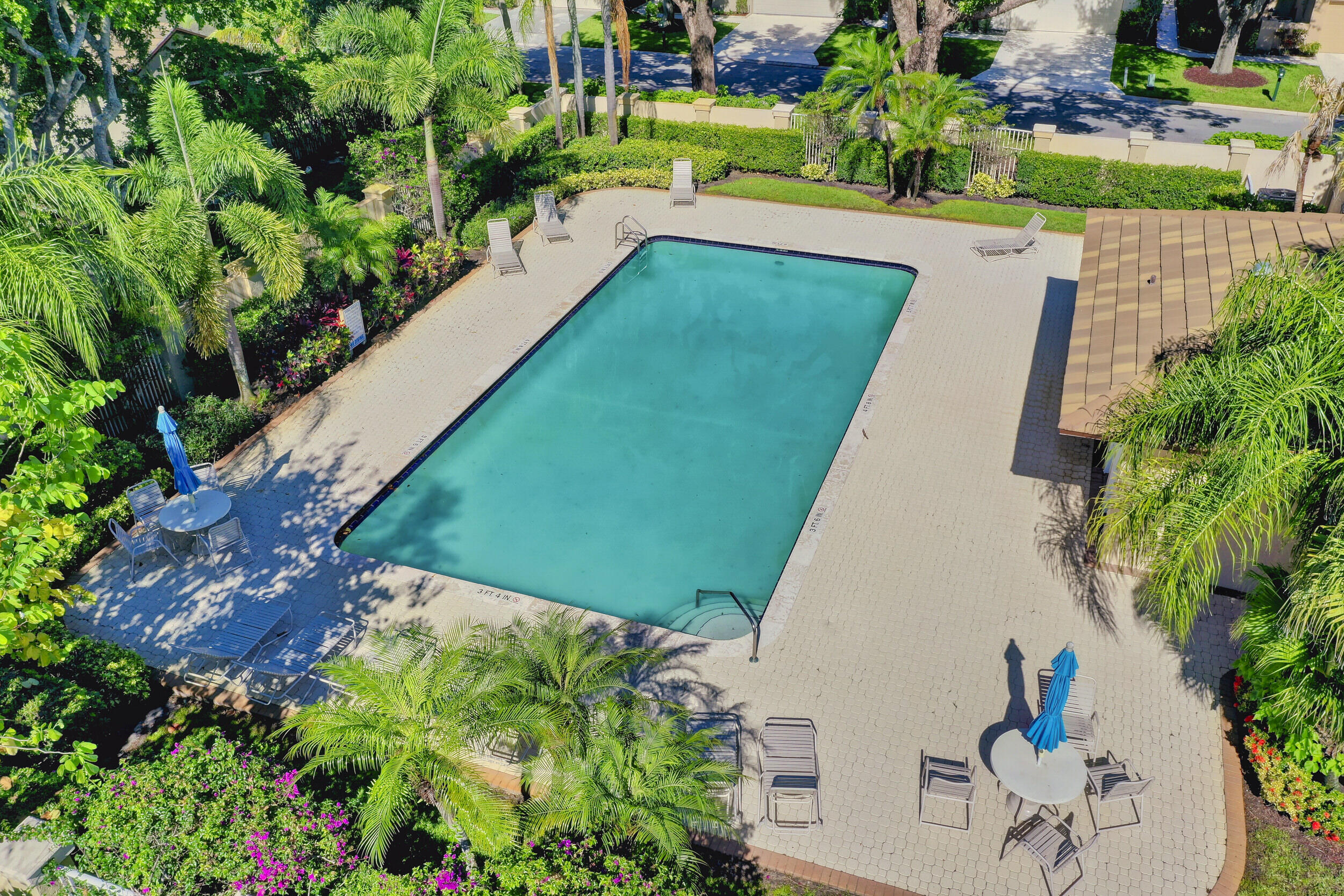 24 Ironwood Way North Palm Beach Gardens, FL 33418 - Photo 68 of 74 a view of a garden with a fountain