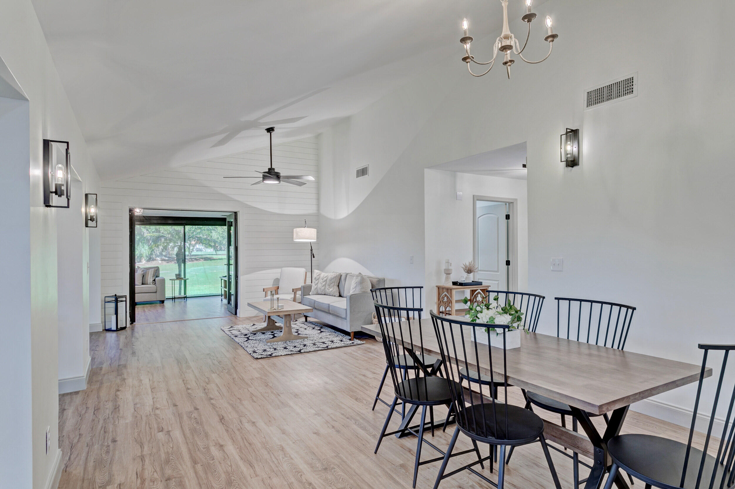 24 Ironwood Way North Palm Beach Gardens, FL 33418 - Photo 10 of 74 a view of a dining room with furniture window and wooden floor