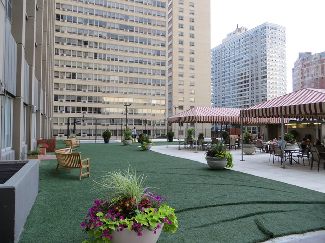 655 West Irving Park Road, Unit 2710 Chicago, IL 60613 - Photo 10 of 11 a view of a building with sitting area