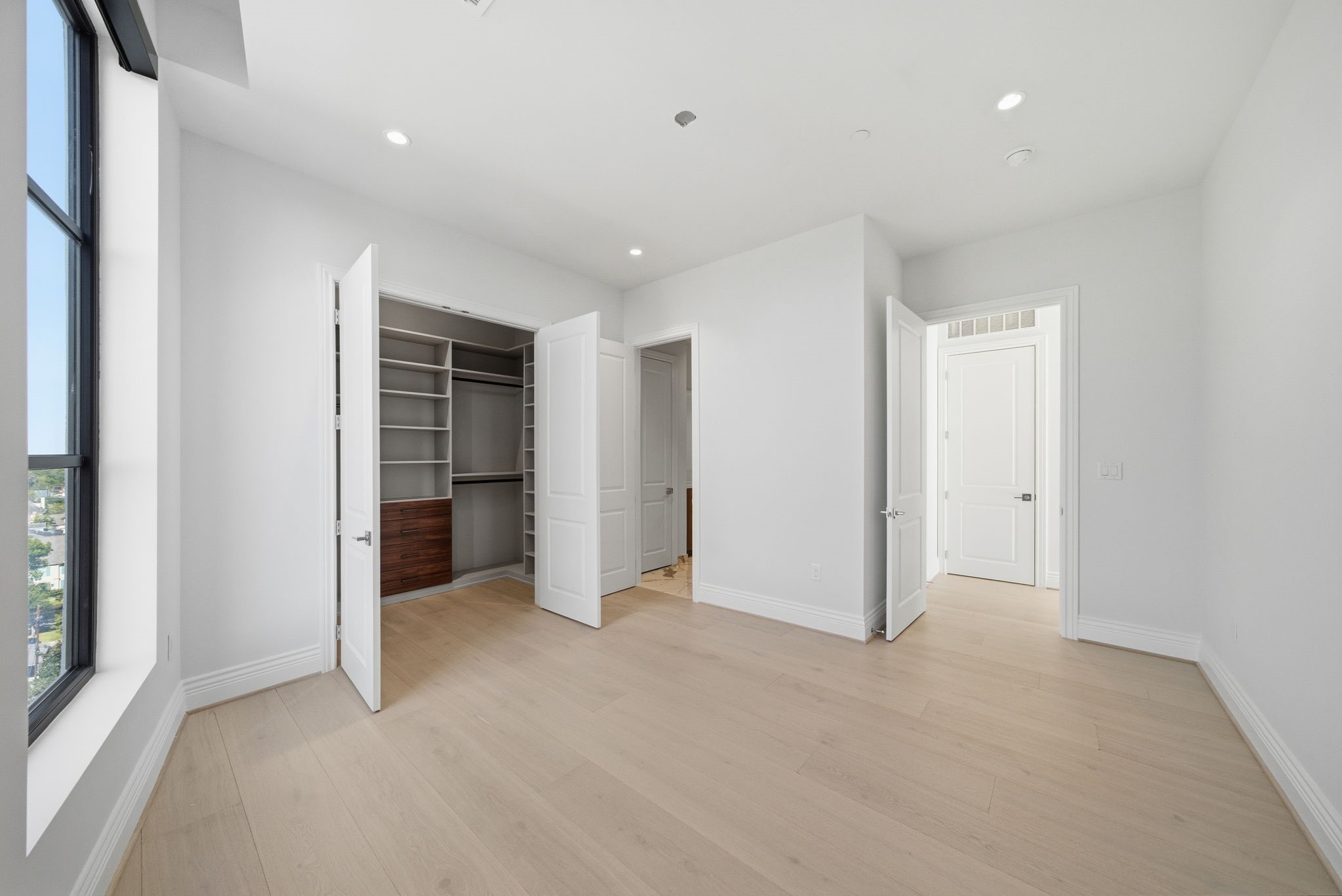 2323 San Felipe Street, Unit 803 Houston, TX 77019 - Photo 24 of 45 Secondary bedroom. This sunlit retreat is conveniently located off the main living, offers nice views of the Galleria and included added binds for privacy along w/upgraded California Closet system with its own amble storage space.