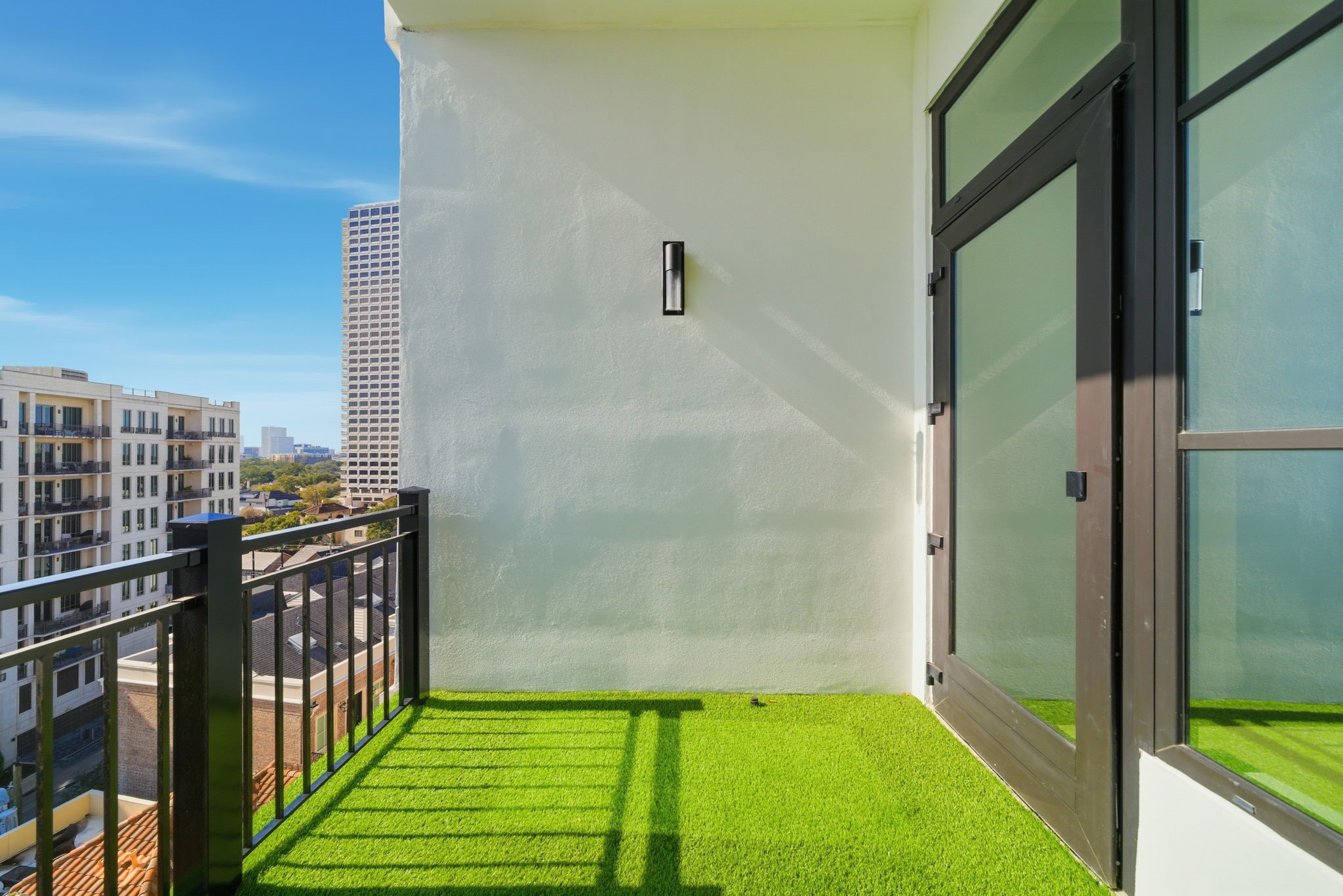 2323 San Felipe Street, Unit 803 Houston, TX 77019 - Photo 31 of 45 Private Balcony: Outdoor extension of the living space with tuft flooring.