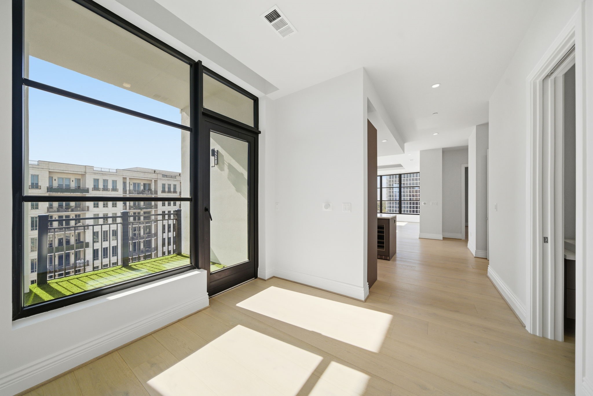 2323 San Felipe Street, Unit 803 Houston, TX 77019 - Photo 5 of 45 Foyer off private elevator combines modern design & with classic luxury. The hallway seamlessly transitions into the heart of the home.