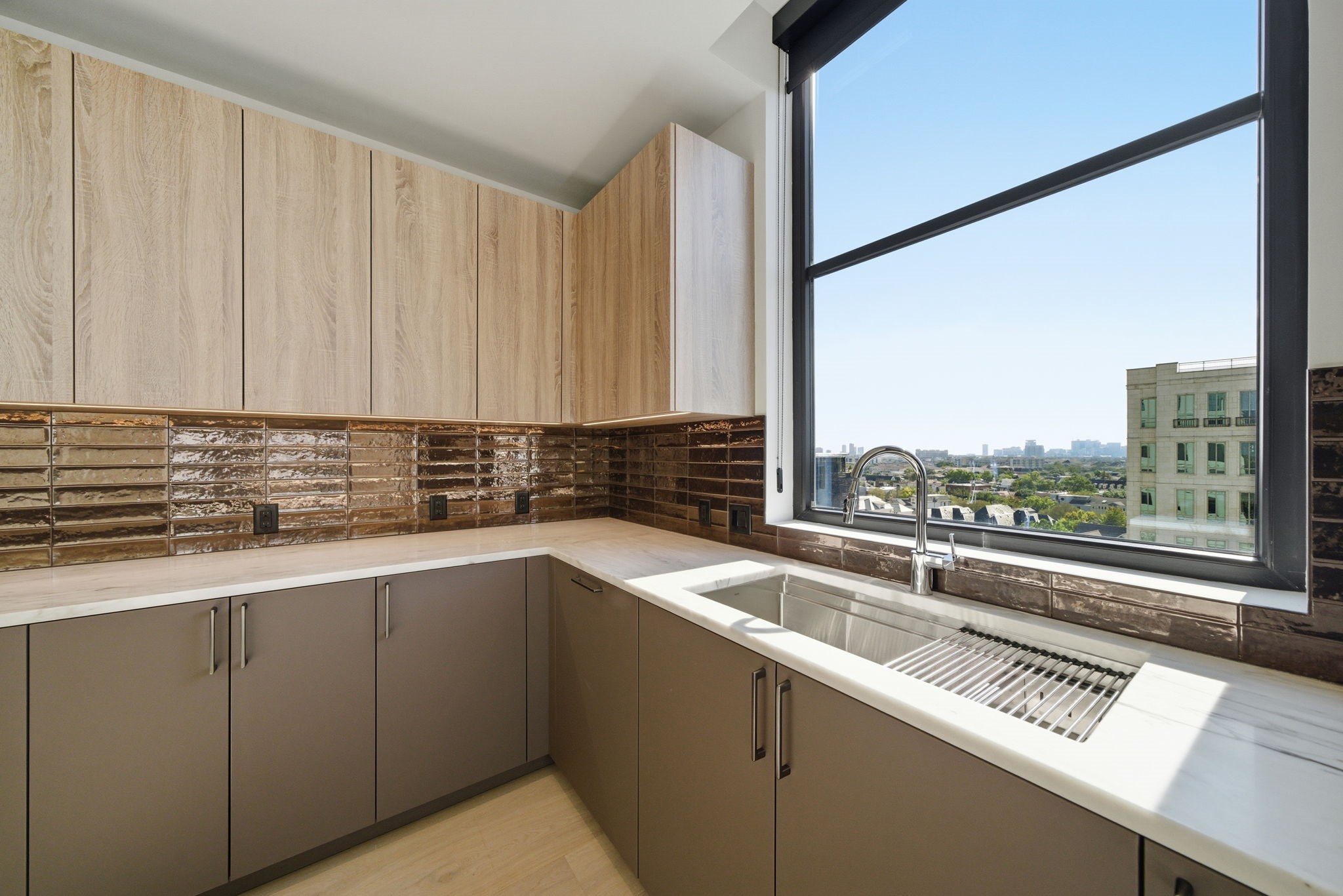 2323 San Felipe Street, Unit 803 Houston, TX 77019 - Photo 6 of 45 A closeup of the sleek design and views from the kitchen sink.