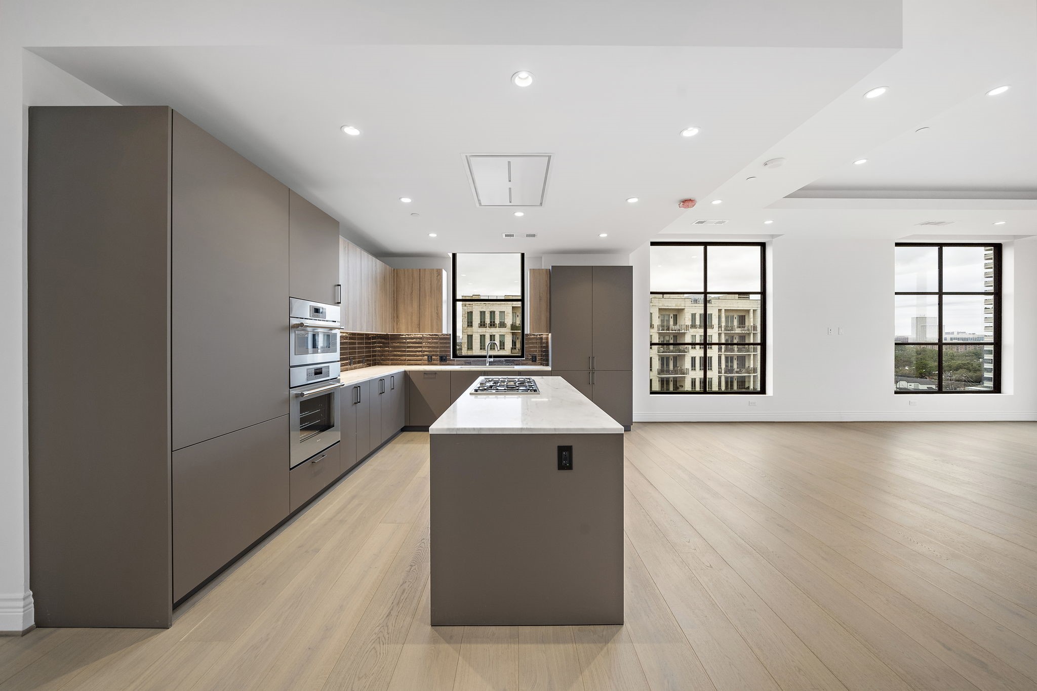 2323 San Felipe Street, Unit 803 Houston, TX 77019 - Photo 8 of 45 Lots of essential storage including pantry, along will under cabinet lighting, updraft venting and soft close drawers.