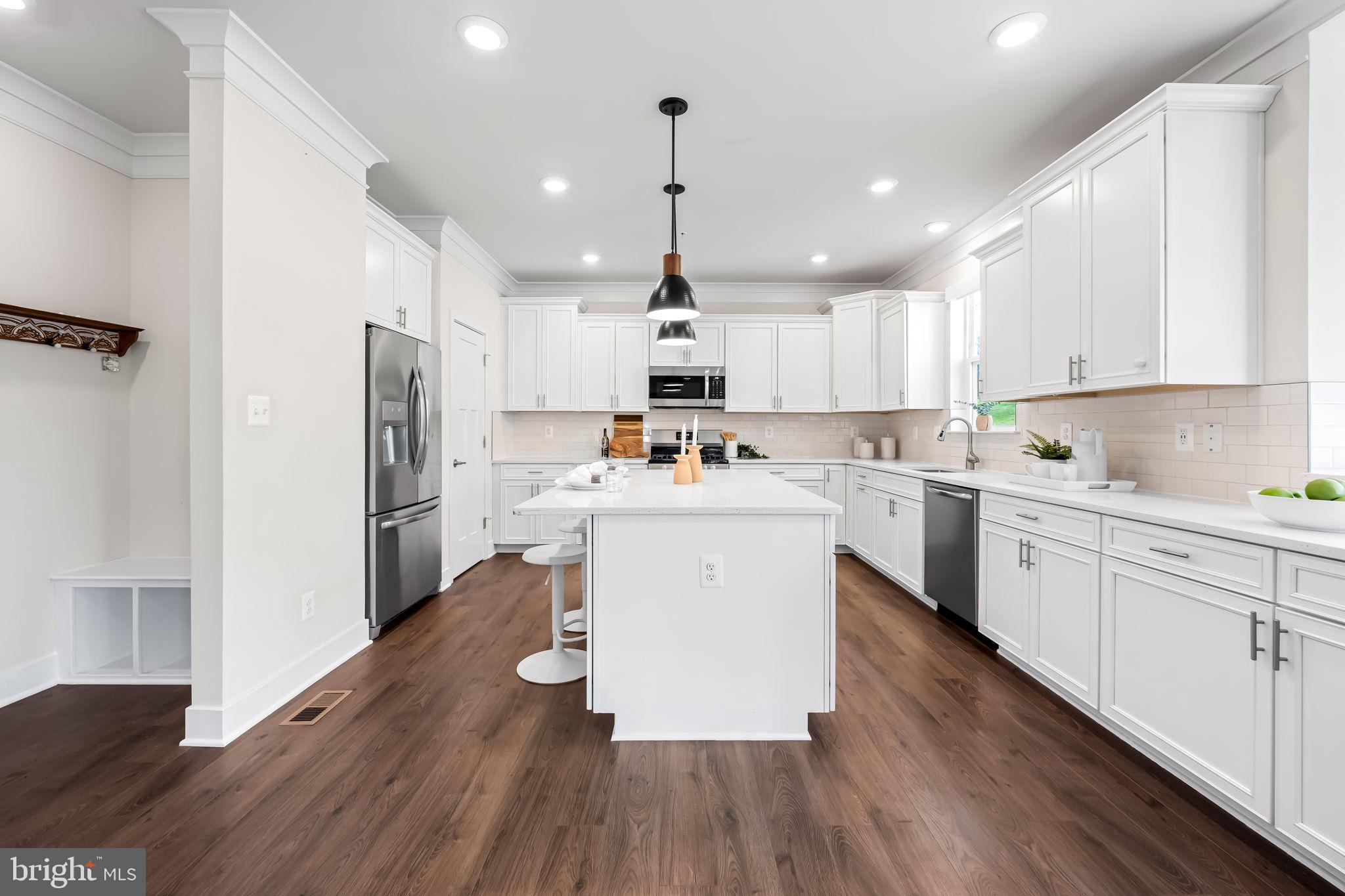 3704 Kahl Farm Road Perry Hall, MD 21128 - Photo 12 of 52 a kitchen with refrigerator cabinets and wooden floor