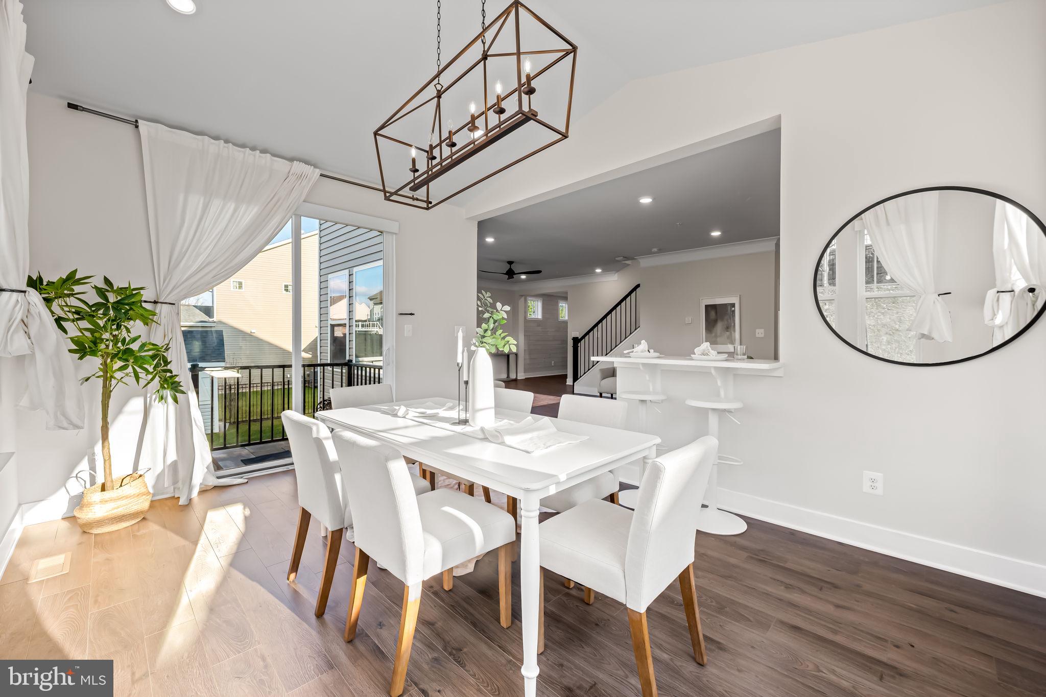 3704 Kahl Farm Road Perry Hall, MD 21128 - Photo 14 of 52 a view of a dining room with furniture window and wooden floor