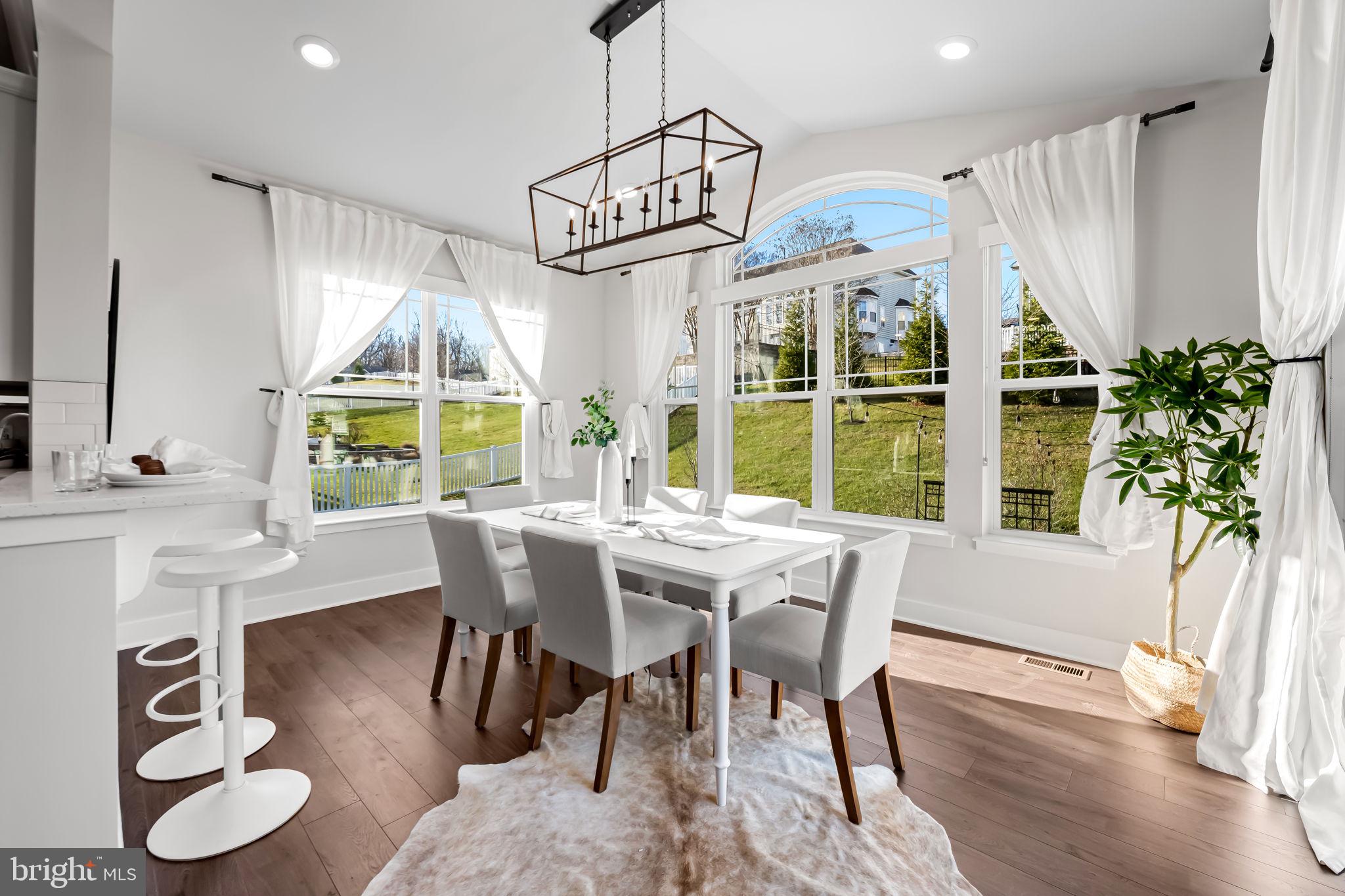 3704 Kahl Farm Road Perry Hall, MD 21128 - Photo 2 of 52 a dining room with furniture window and wooden floor