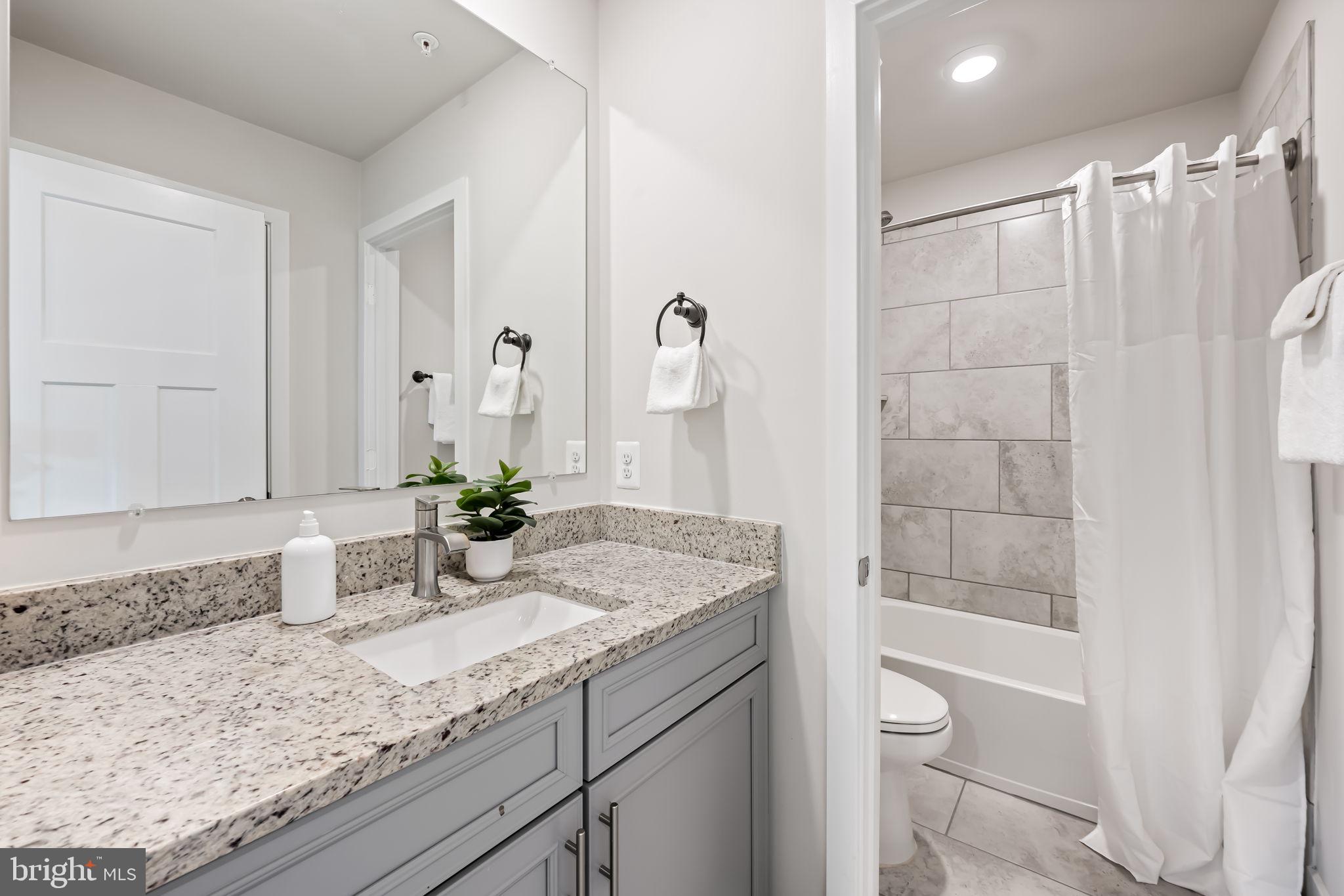 3704 Kahl Farm Road Perry Hall, MD 21128 - Photo 27 of 52 a bathroom with a granite countertop sink and a mirror