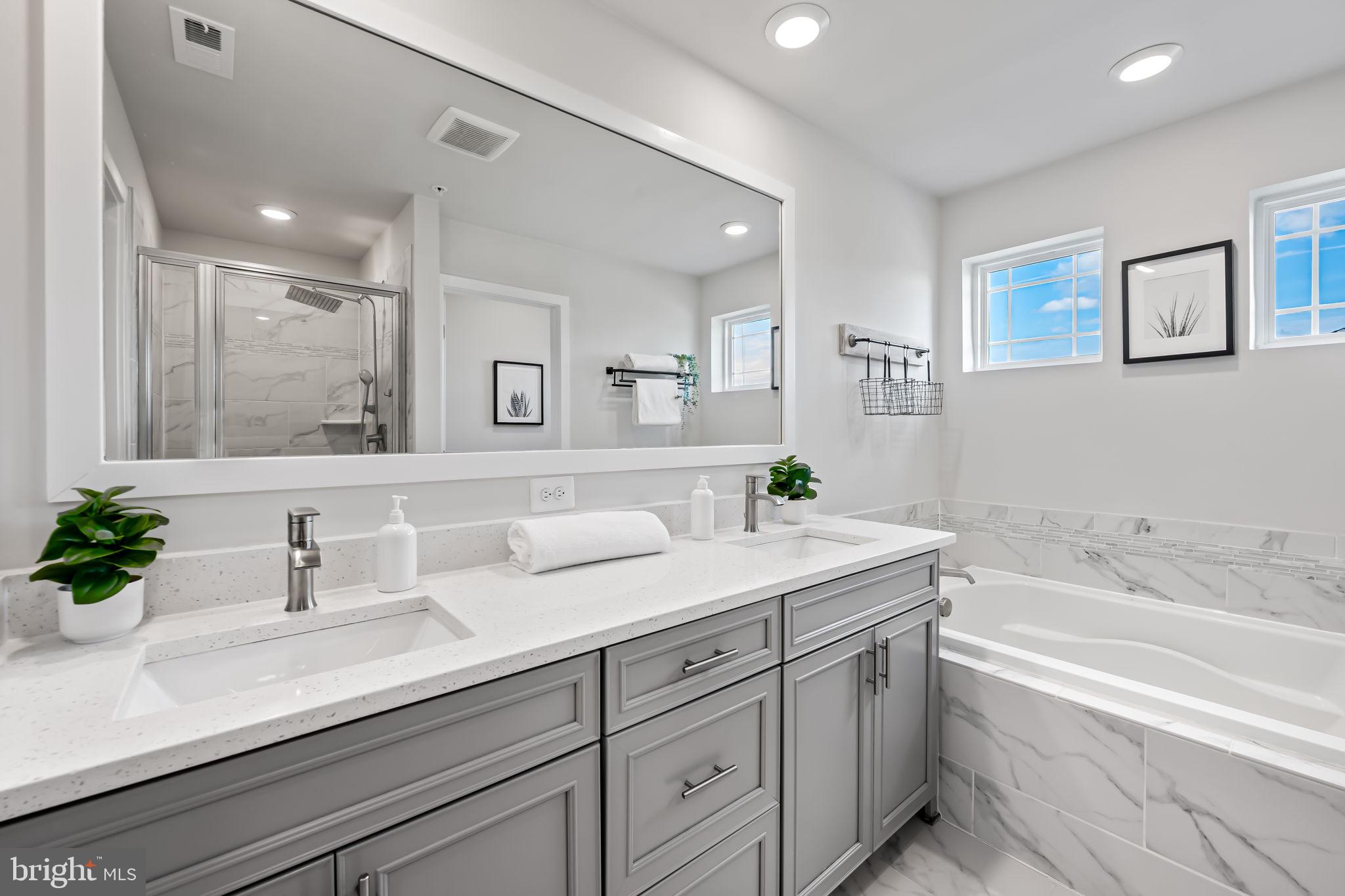 3704 Kahl Farm Road Perry Hall, MD 21128 - Photo 34 of 52 a bathroom with a sink double vanity granite tub and a mirror