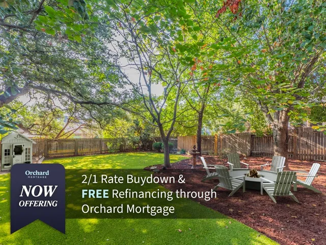 a view of a park with bench and trees