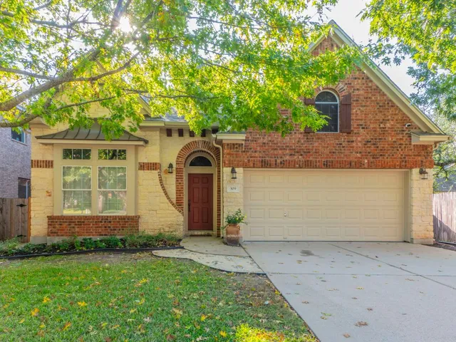 a view of a hallway view with wooden floor and staircase