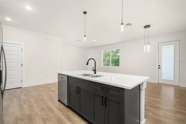 a view of a room with wooden floor and window