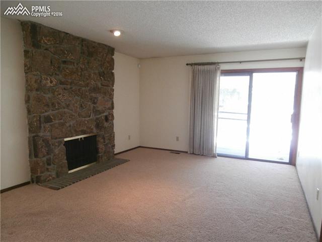 2870 Valencia Road Colorado Springs, CO 80917 - Photo 8 of 20 Spacious Master Bedroom with walk out to upper level deck