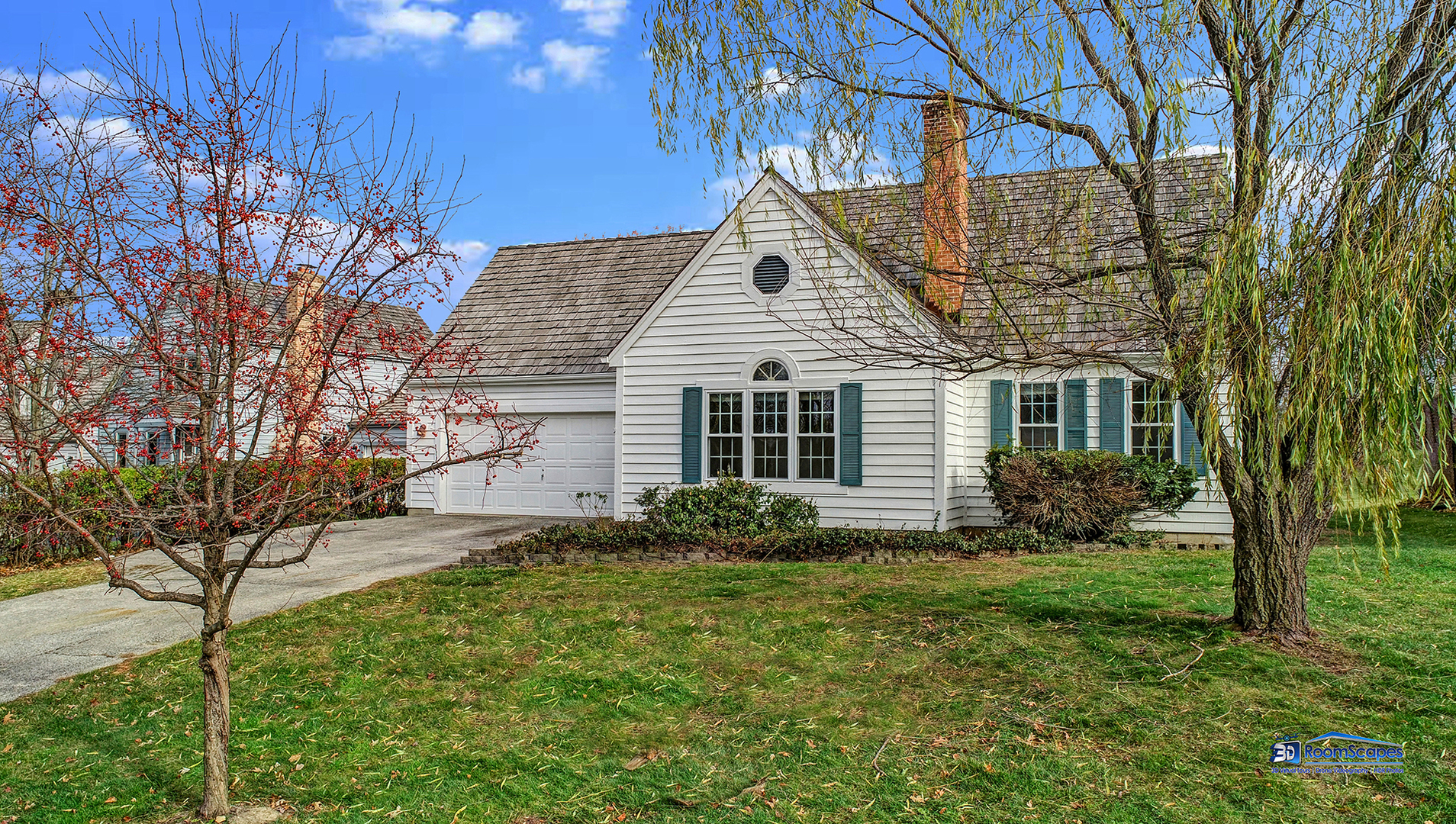 a view of a house with yard and a garden