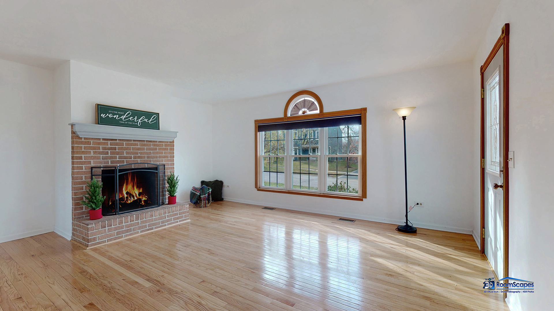 277 Mayflower Court Gurnee, IL 60031 - Photo 5 of 42 a view of a livingroom with wooden floor and a fireplace
