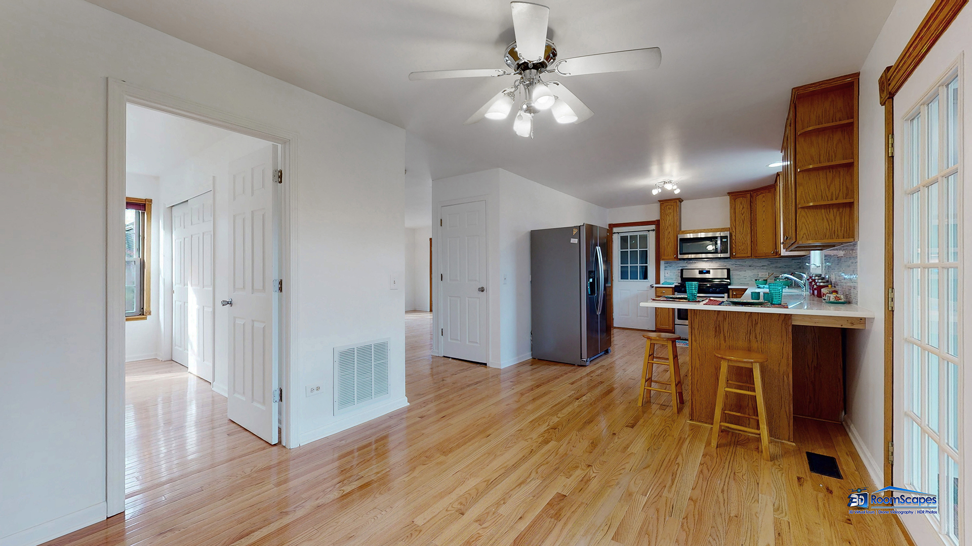 277 Mayflower Court Gurnee, IL 60031 - Photo 8 of 42 a living room with stainless steel appliances granite countertop furniture wooden floor and a kitchen view