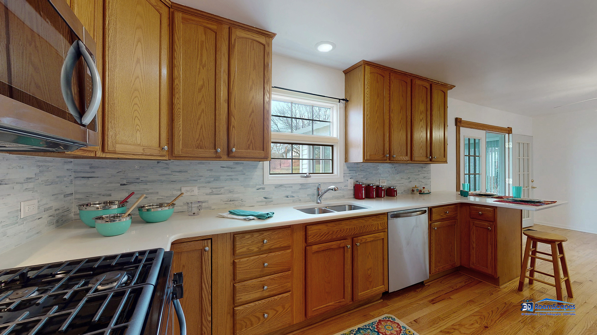 277 Mayflower Court Gurnee, IL 60031 - Photo 9 of 42 a kitchen with stainless steel appliances granite countertop wooden cabinets a sink and dishwasher