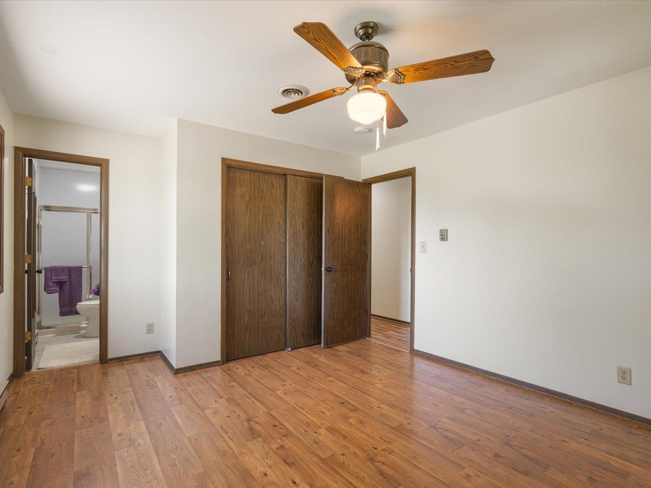 136 Lake Summerset Road Lake Summerset, IL 61019 - Photo 15 of 47 an empty room with wooden floor and windows