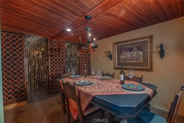 a view of a patio with table and chairs and potted plants