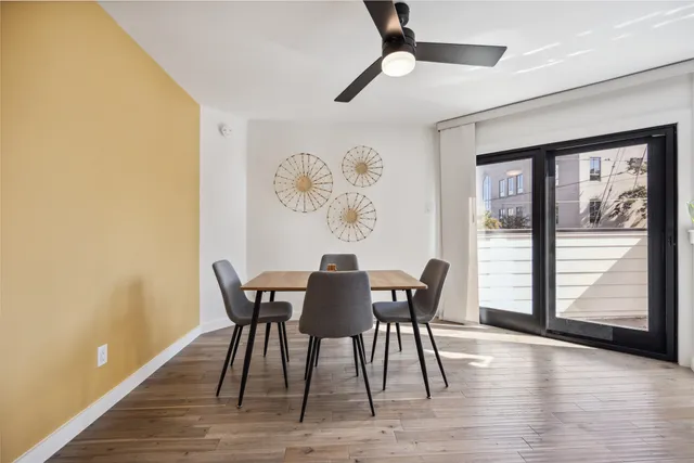 a view of a dining room with furniture window and wooden floor