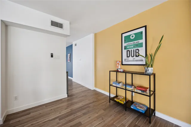 a view of front door with wooden floor
